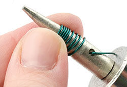 Wire being wrapped around mandrel